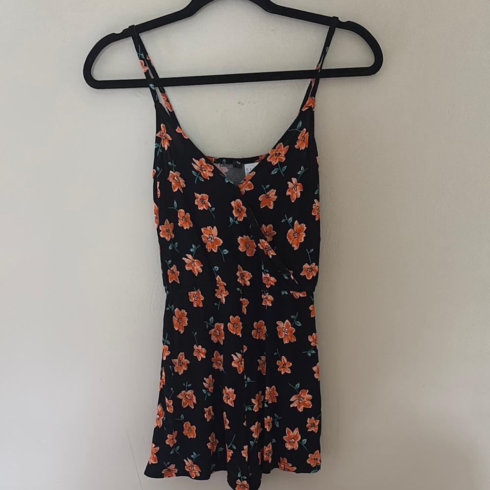 Divided Black Romper with Vibrant Orange Floral Pattern